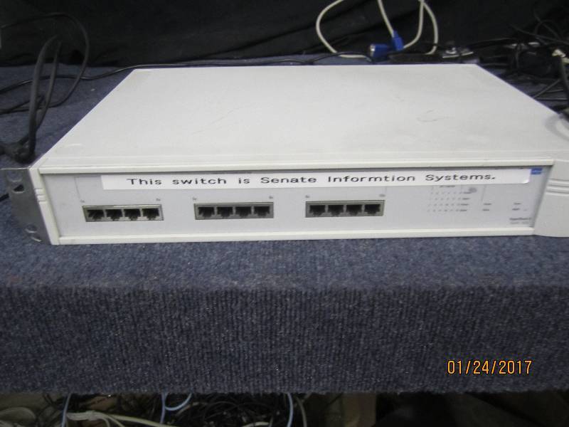 lot 15 image: 3COM Super Stack Switch, powers up...