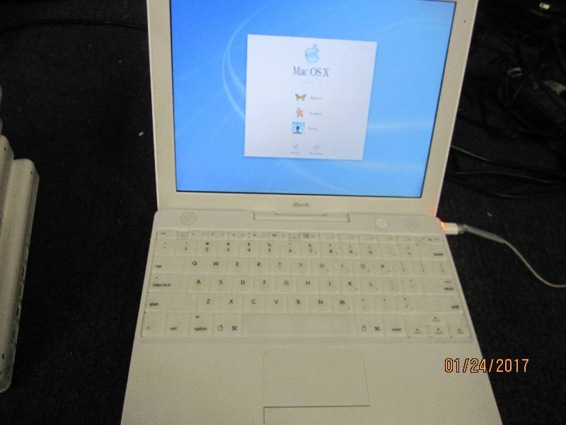 lot 16 image: Apple iBook , boots up, no power co...