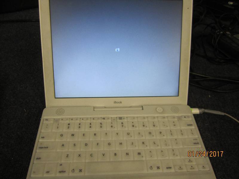 lot 18 image: Apple iBook , powers up, no power c...