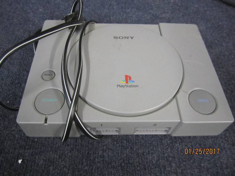 lot 55 image: Sony PlayStation Console, powers on...