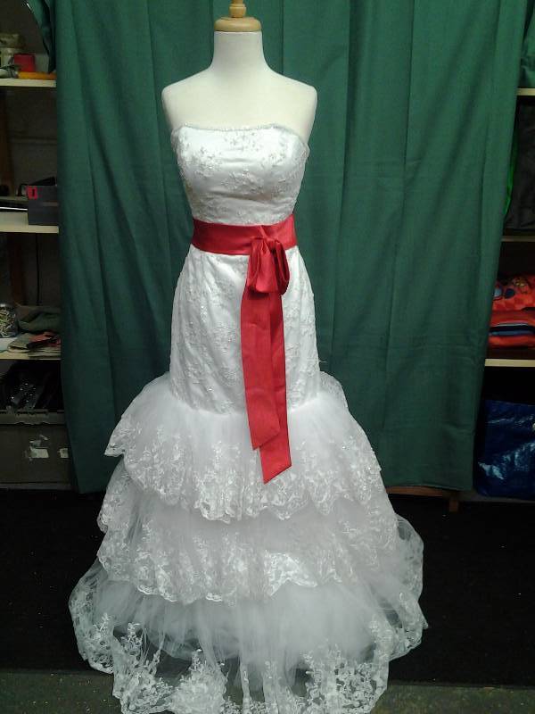 white gown with red belt