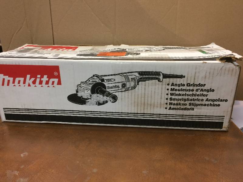 lot 58 image: Makita 15 Amp 7 in. Angle Grinder with Lock-Off and No Lock-On Switch open box never used