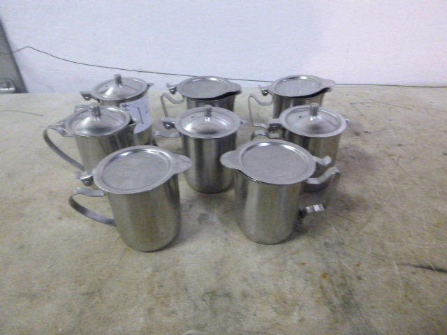 lot 26 image: 8 Tea Pots