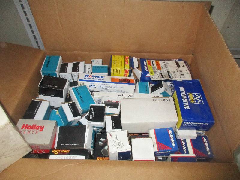 box of assorted car parts