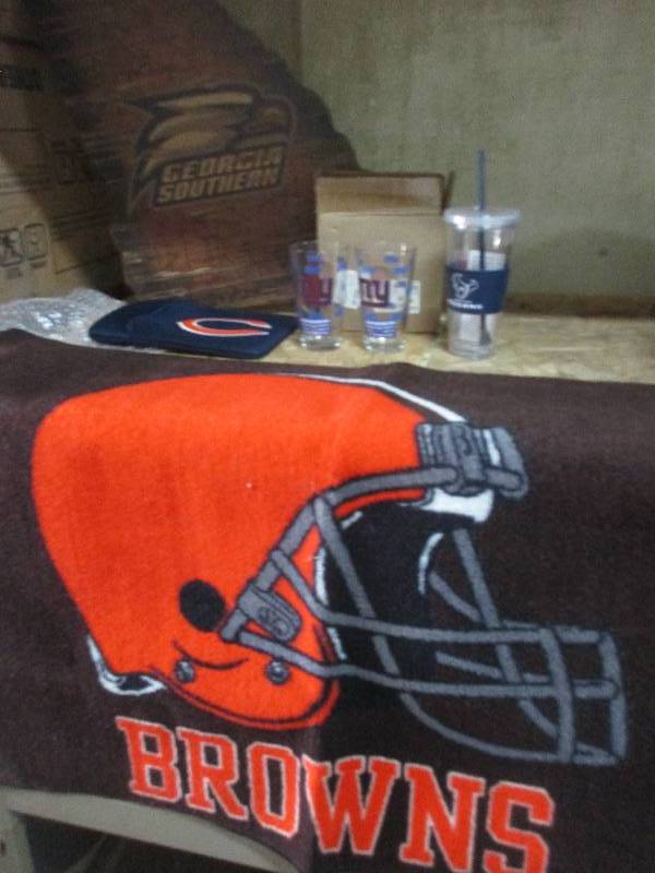 football stuff - browns carpet, New York giants cups, Texans cup, southern Georgia wall decor