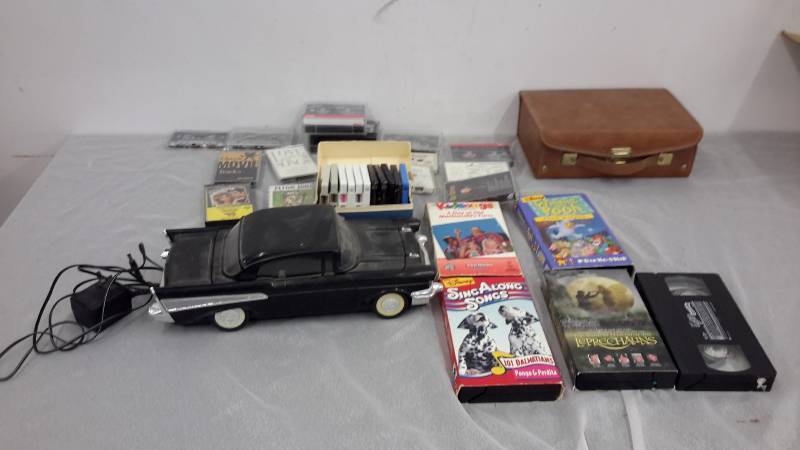 lot 5 image: VHS and cassette tapes, 57 Chevy VHS rewinder