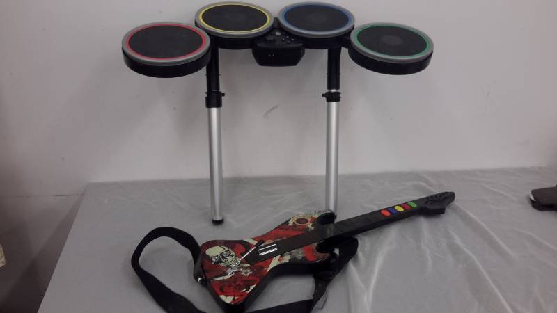 lot 9 image: Gaming guitar and drums