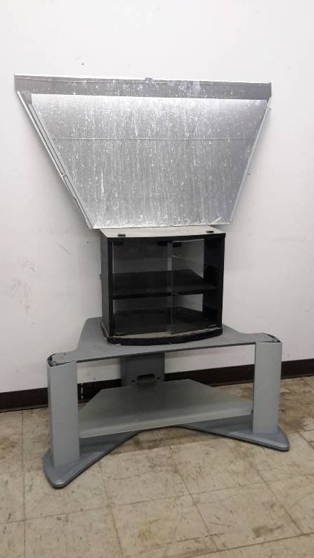 lot 50 image: 2 trapezoidal shaped mirrors, 2 television stands