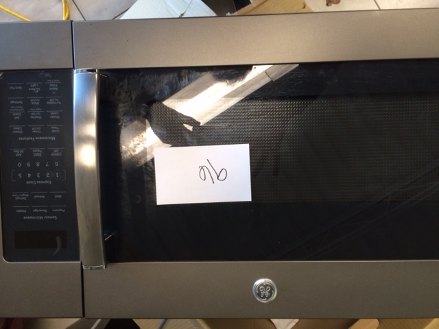 lot 96 image: GE over the Range Microwave Oven