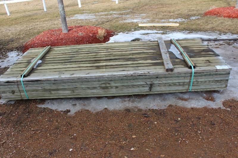 lot 1849 image: Lot of (104) 2 x 4 x 10 ft Treated Studs