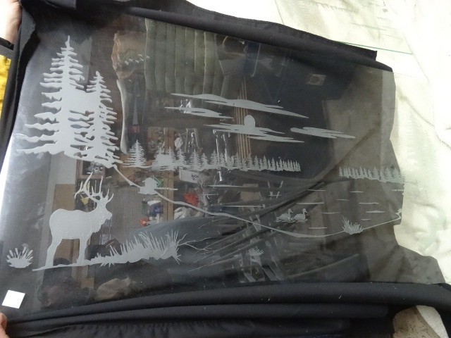 Tempered glass with etched wildlife...