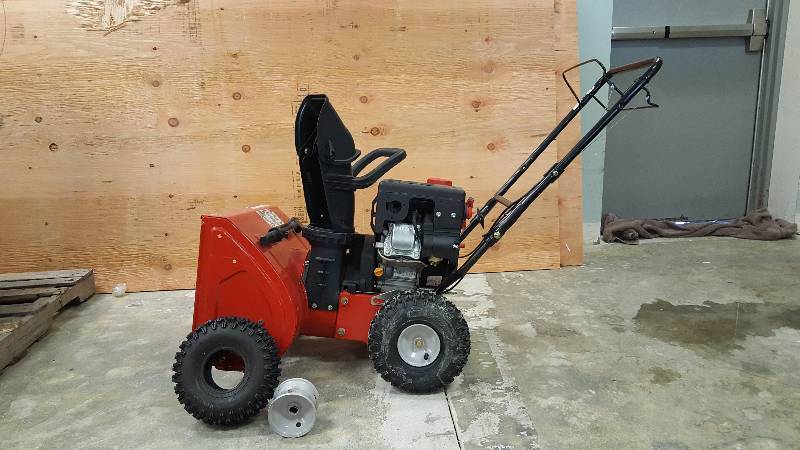 lot 266 image: Yard Machines 22in 179cc Two-Stage Snow Blower BAD TIRE - GOOD WORKING CONDITION