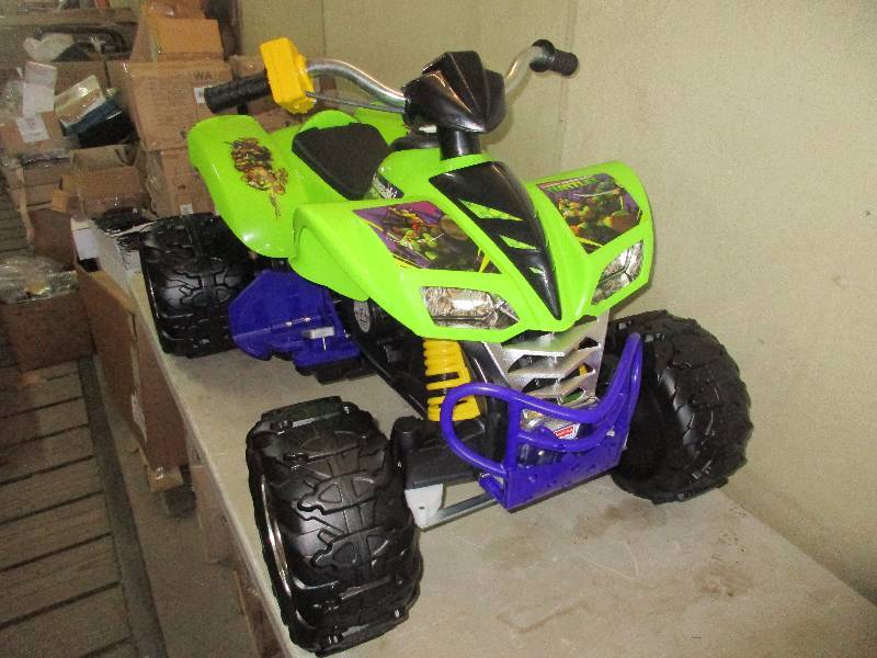 lot 13 image: KAWASAKI KFX 4 WHEELER 12 VOLT POWER WHEELS NINJA TURTLES EDITION - NEW