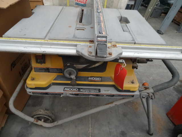 lot 12 image: Ridgid 10 table saw with job site ...