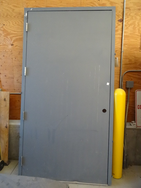 lot 79 image: Large steel door with frame. 48 x 9...