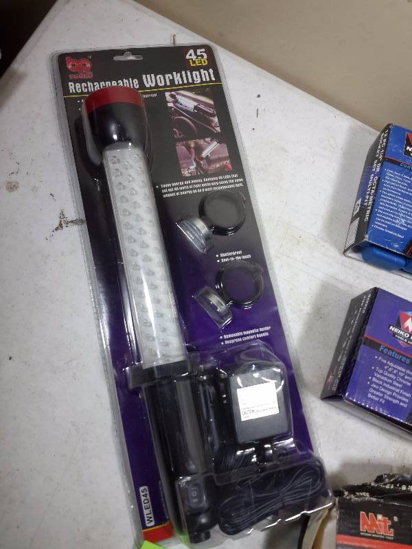 lot 46 image: 4 piece Solid Steel Pry Bar Set Rechargeable Work light 19 piece Socket Set, 5 piece adjustable wrench set O Ring set