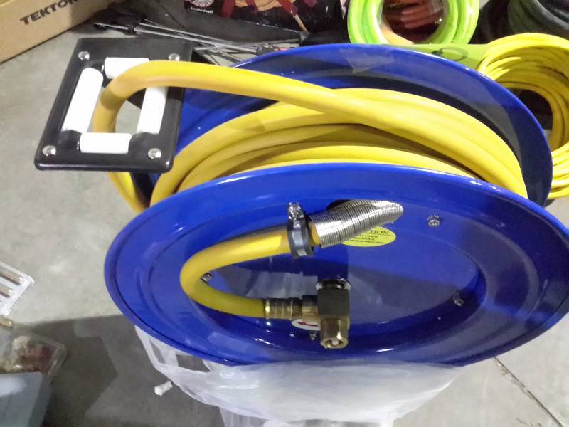 lot 91 image: Hose Reel with 50 ft of 12 in hose.. All new