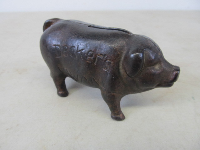 lot 15 image: Orig Antique Cast Iron Advertising Piggy Bank