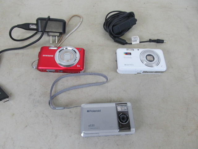 lot 35 image: 3 Nice Digital Cameras - 2 wAdapters