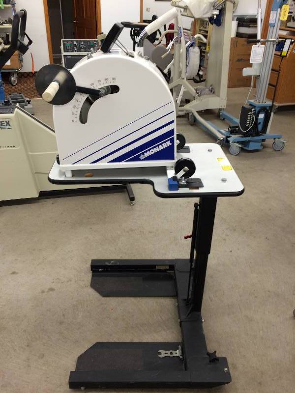 lot 57 image: WOW Retails For $4000 MONARK UPPER LOWER BODY ERGOMETER REHAB TRAINER MODEL 881 LEG OR HAND CYCLE LOTS OF EXTRAS PLUS BOLTED ON A HEIGHT ADJUSTABLE STAND - EXCELLENT CONDITION