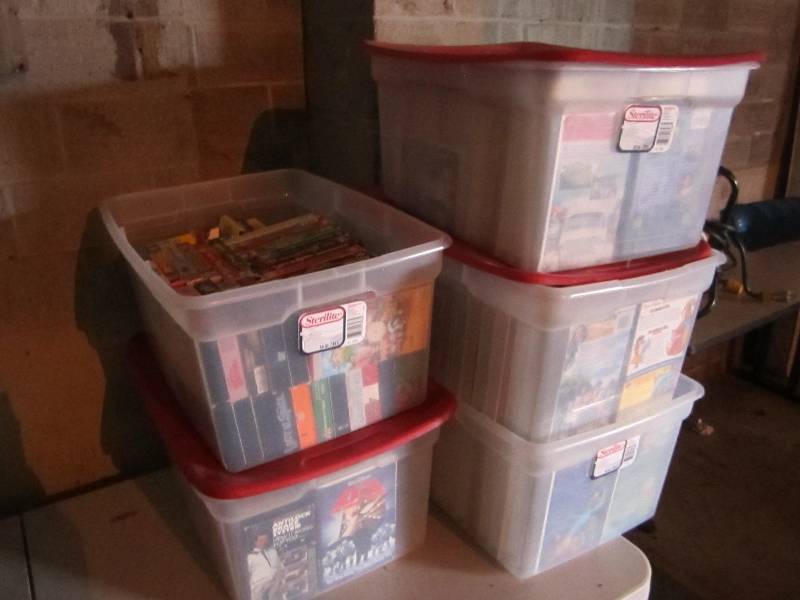 5 plastic totes with mainly childre...