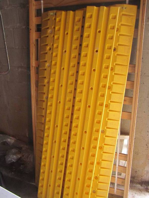 2 plastic speed bumps or parking gu...