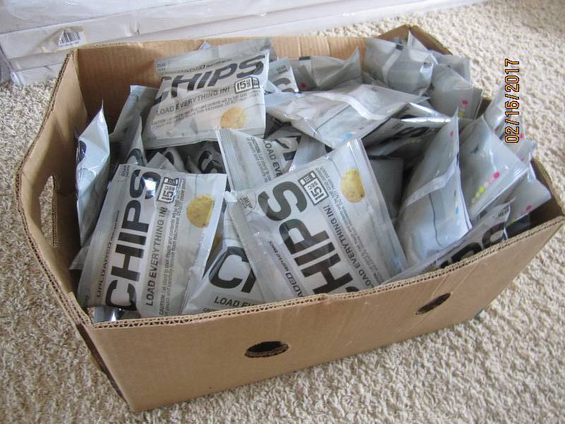 Box filled with single serve chip p...