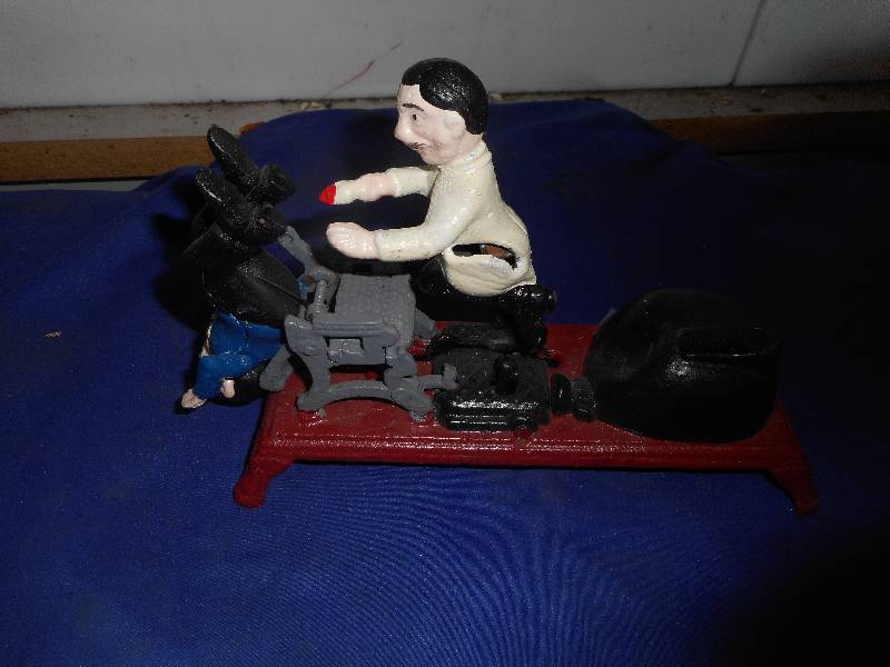 VINTAGE DENTIST CAST IRON COIN BANK