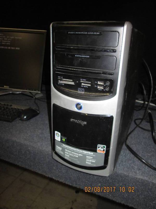 lot 63 image: Emachines PC, no hard drive, powers...