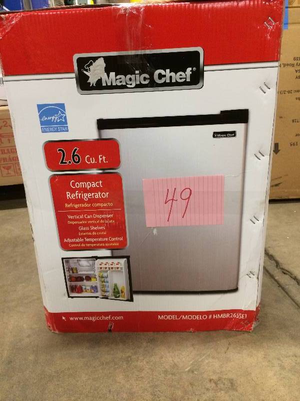 lot 49 image: Magic Chef 2.6 Cu Ft Compact Refrigerator dent on side never used