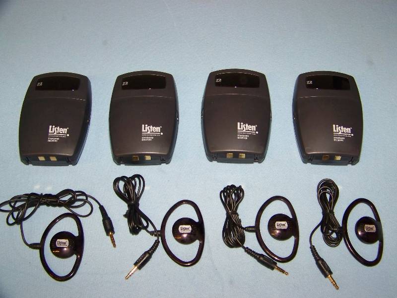 lot 97 image: (4) Listen, Assisted Hearing Receivers, Ear Pieces and Charging Station