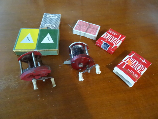 lot 34 image: 2 vintage fishing reels. Misc decks...