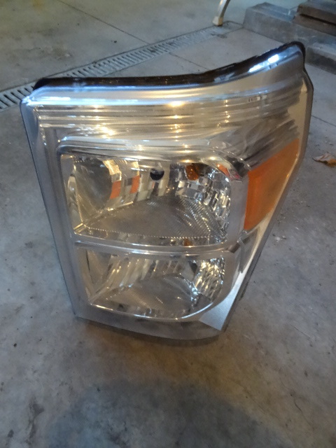 lot 103 image: Drivers side front head light assem...