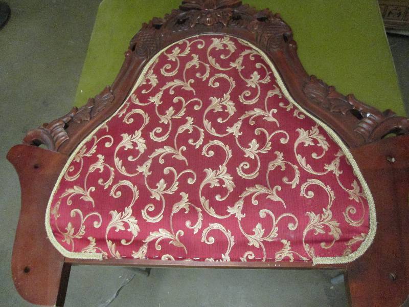 a back to a chair and a pillow ...