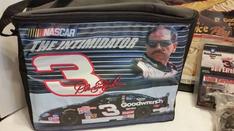 lot 244 image: Large Lot of #3 Dale Earnhardt Memorabelia - Print, Summer Cooler, #3 Dale Earnhardt Glass, Twin Pack Playing Cards and Beenie Stuffed Toy