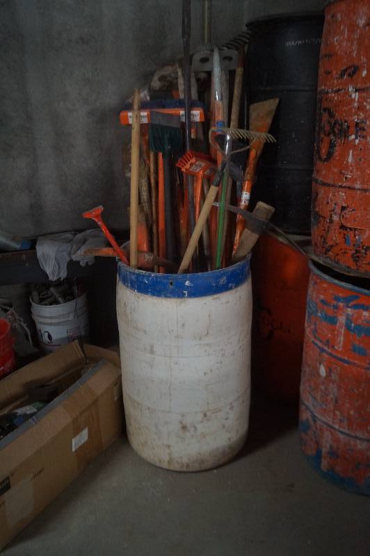 lot 43 image: Barrel of Scapers, Brooms etc.
