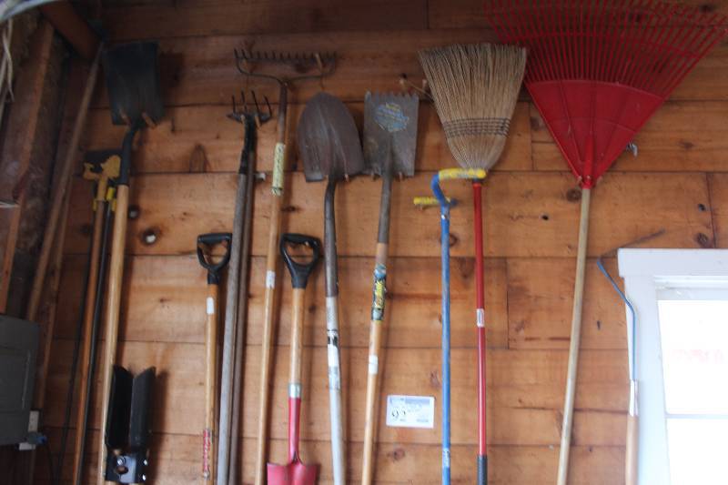 lot 92 image: Wall Lot of Hand Yard Tools Includes Rakes, Shovels, Brooms