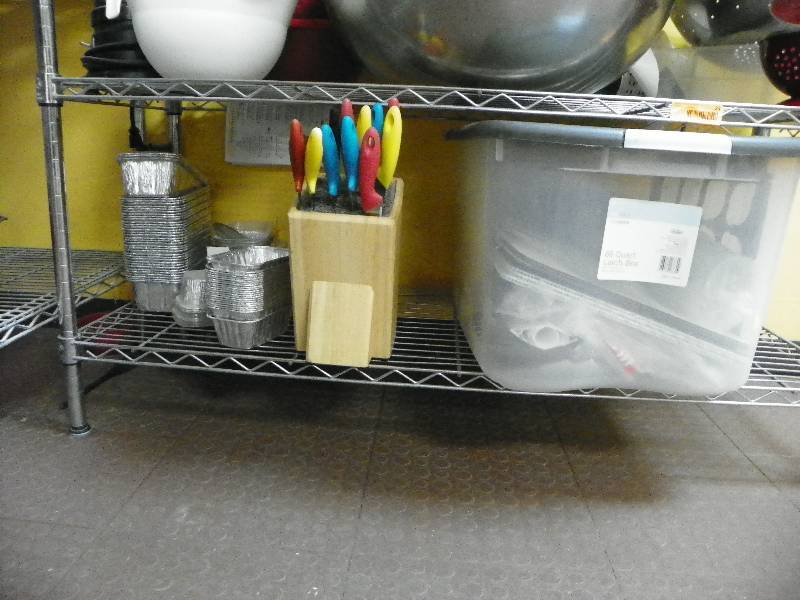 kitchen items, storage tub, knives and small bread loaf pans