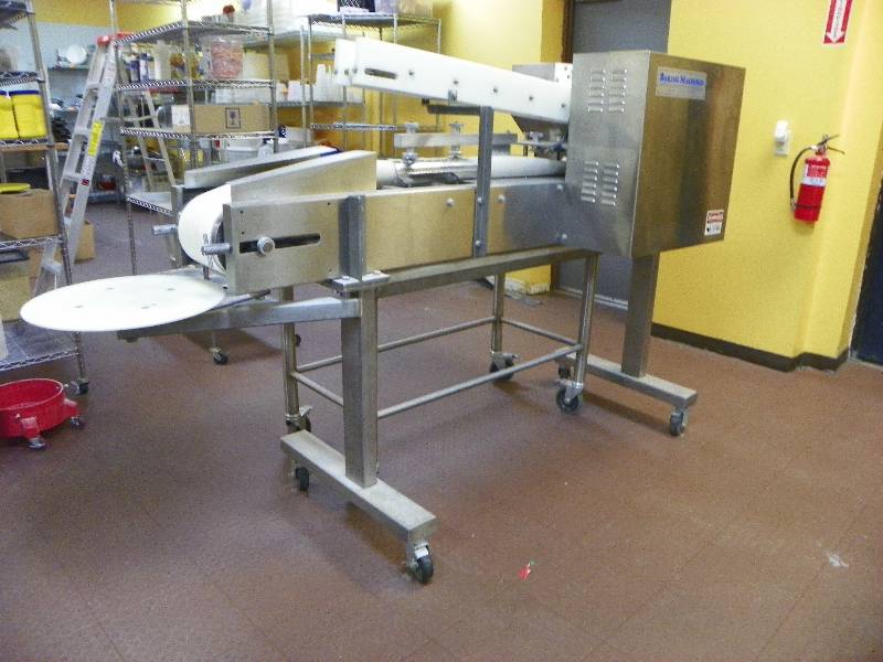 Baking Machines Bagel Machine and Table. Machine is 30.5 wide x 90 long. Table is 48 wide x 31.5 tall x 24 deep