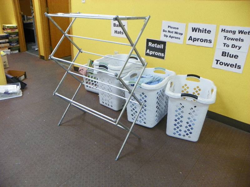 Laundry baskets and drying rack with linens