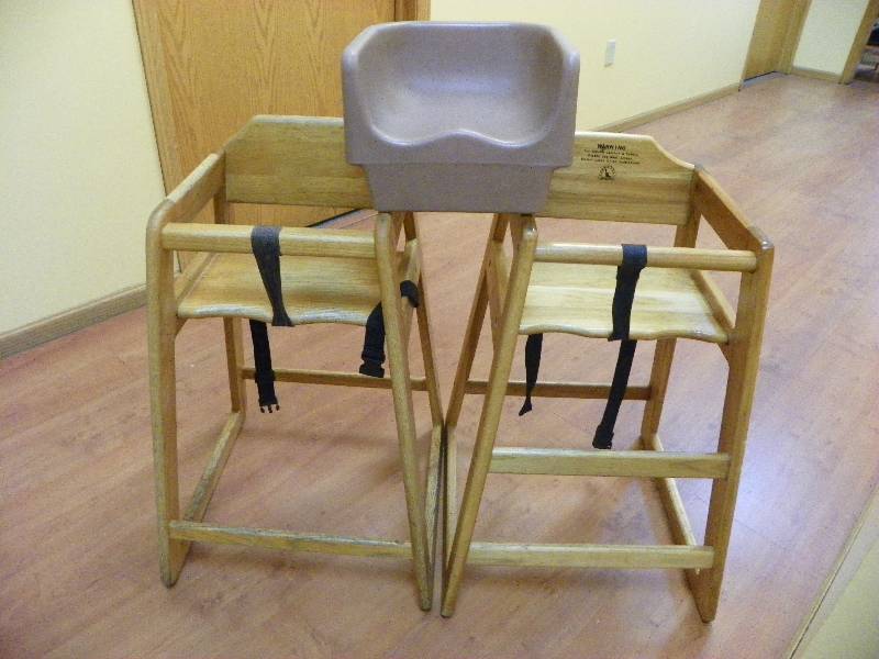 Two high chairs and a booster seat
