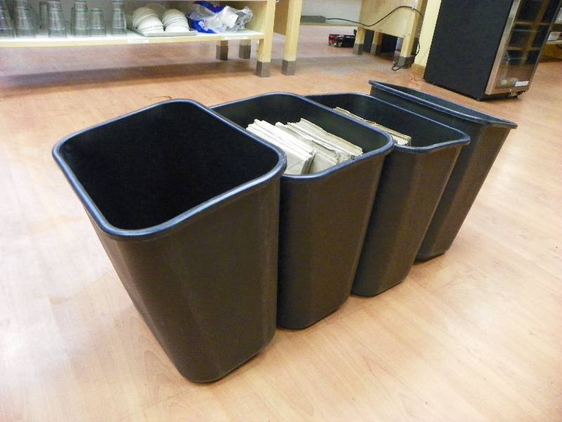 4 trash cans and paper bags