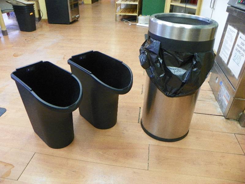 three trash cans
