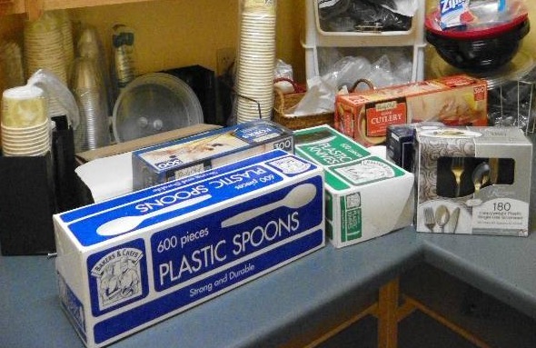 Kitchen items, misc assortment of items, plastic cutlery, cups and more