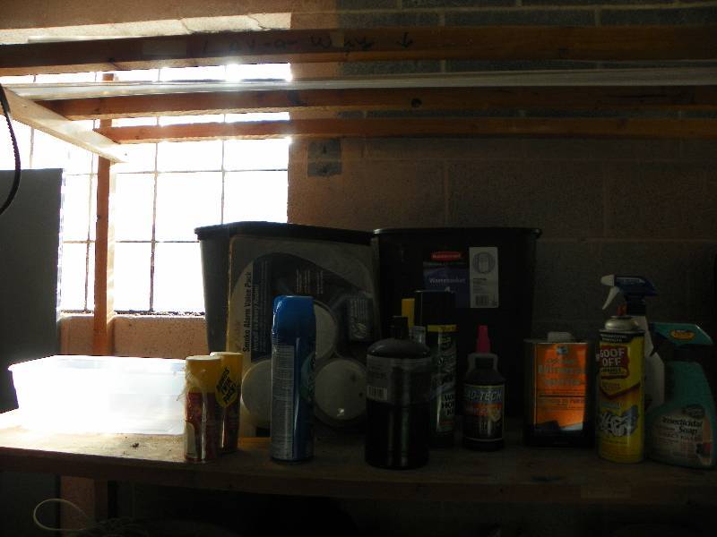 Trash can, smoke alarms and cleaning supplies