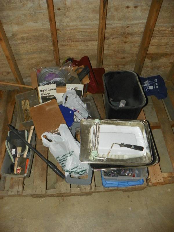 Painting supplies and trash can
