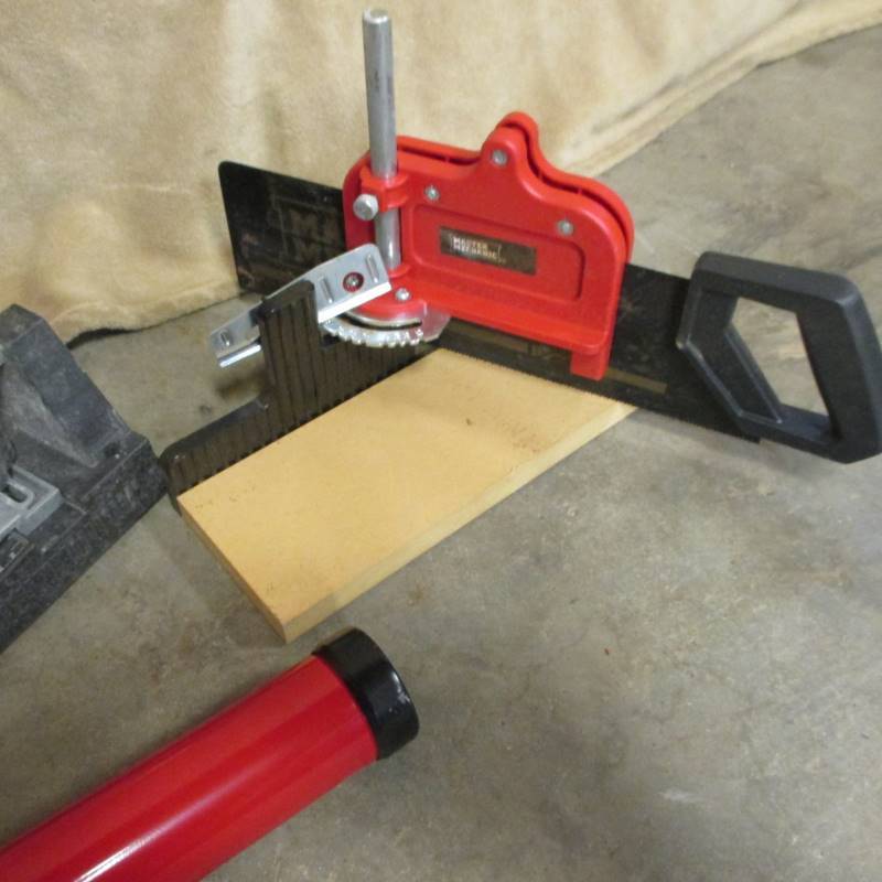 lot 12 image: Miter Box Saw, Ceramic Tile Cutter, Caulk Gun