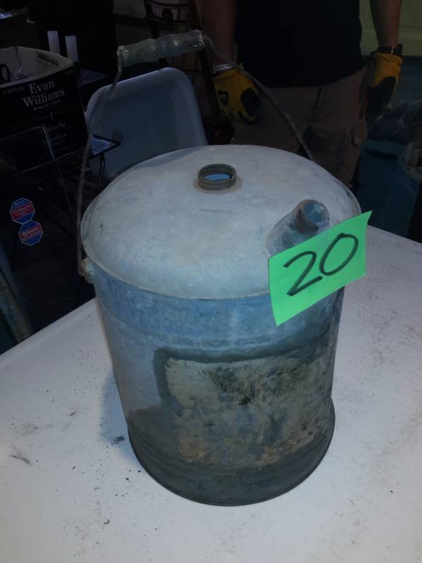 Tin Gas Can.  Has some writing, but  cant quite make it out.  11in x 15in h