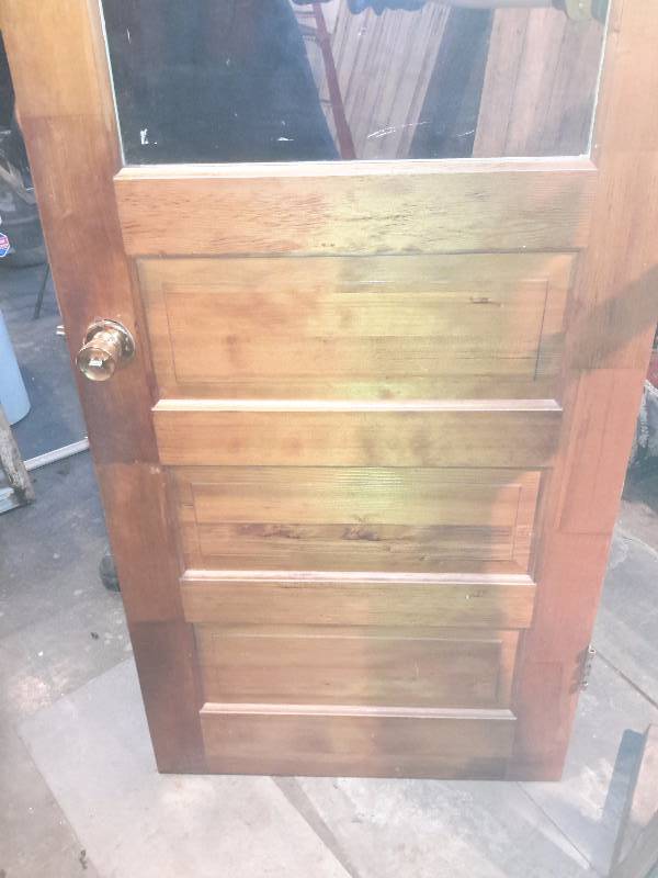 1 38 in thick.  30 in x 80 in 3 panel with Window.