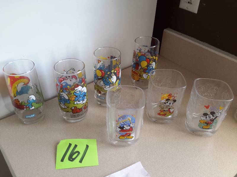 4 Smurf drinking glasses.. 3 MickeyMinnie Drinking glasses